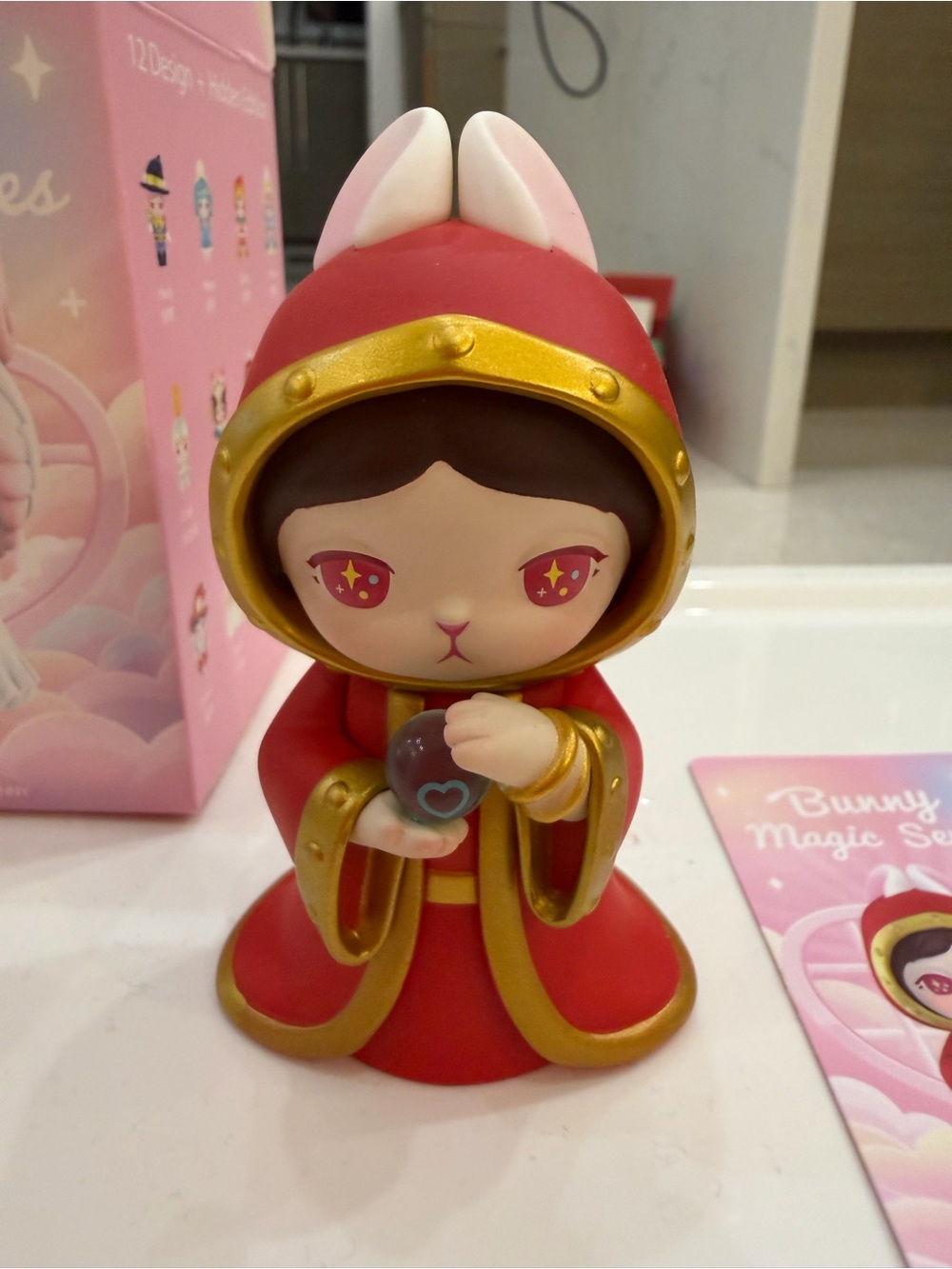 Red Bunny Hooded Figurine Toy with Gold Trim